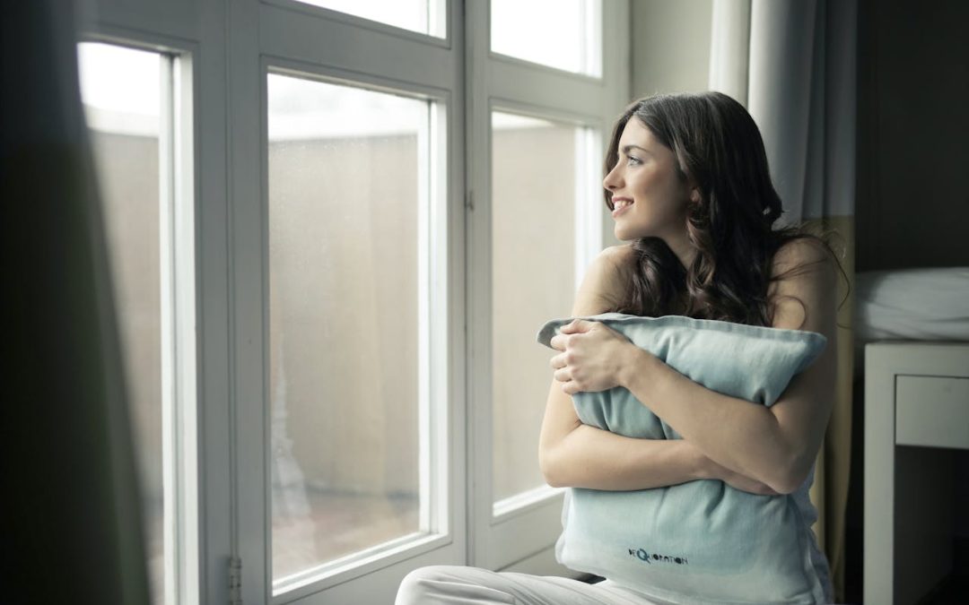 woman looking outside window